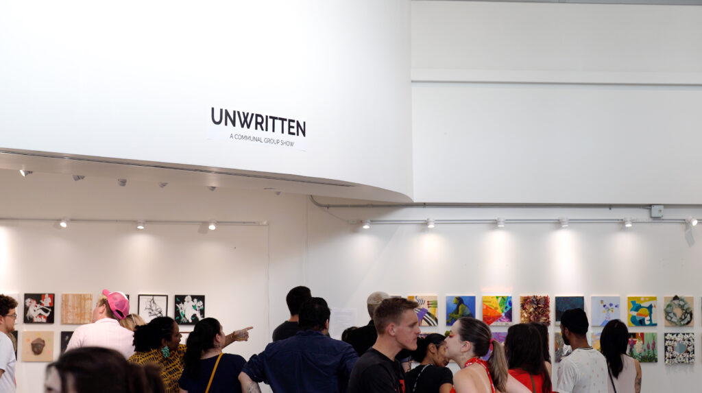 A sea of people at the opening reception of Unwritten